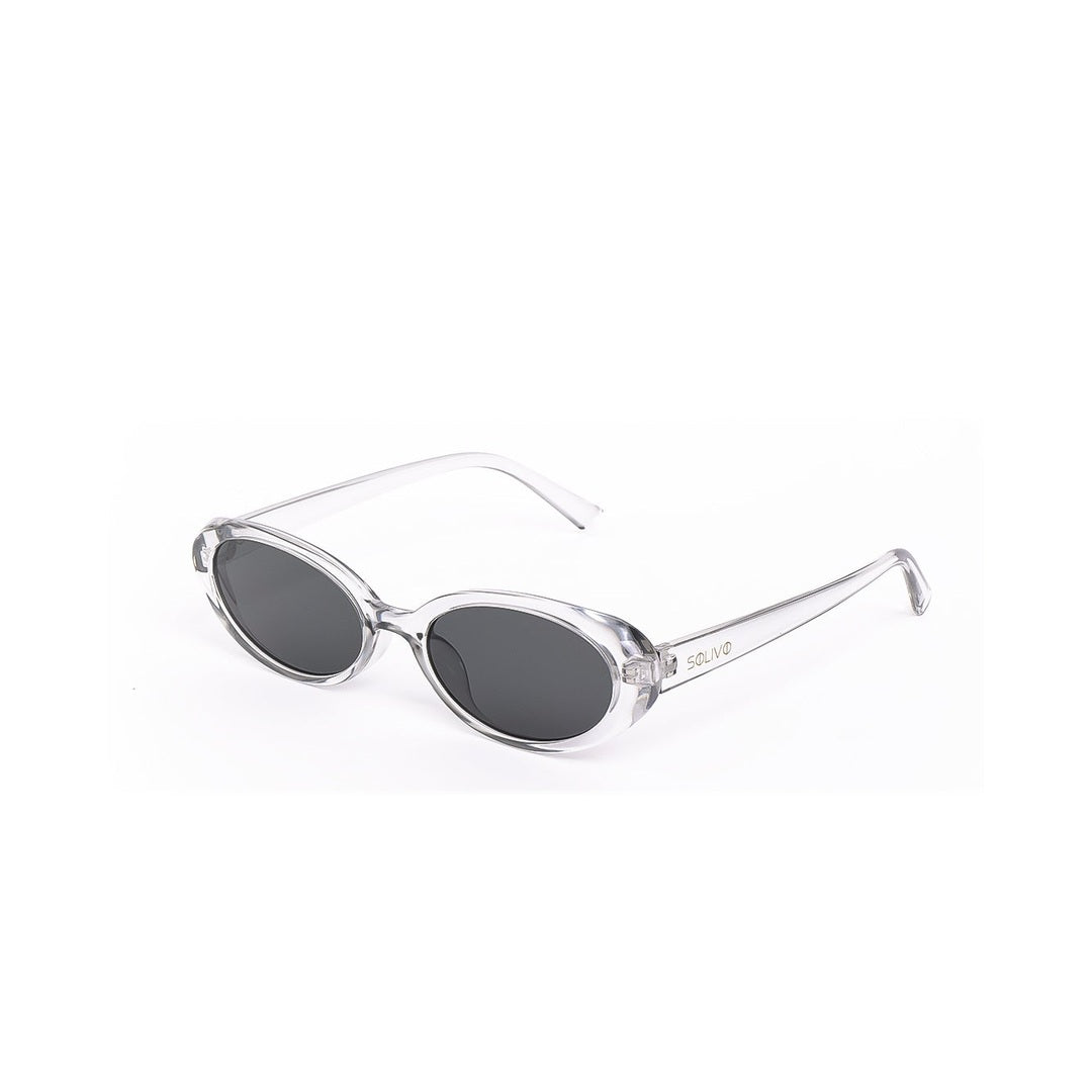 Gafas de sol RONIZ - Cristal de Solivo, con forma ovalada y estructura transparente, capturadas desde el lado.